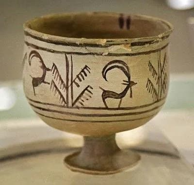 A 5,200-year-old pottery bowl discovered in Shahr-e Sukhteh, Iran has five images painted around it that seem to show phases of a goat leaping up to nip at a tree.